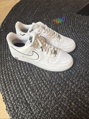 Nike White Low-Top Leather Sneakers with Black Swoosh